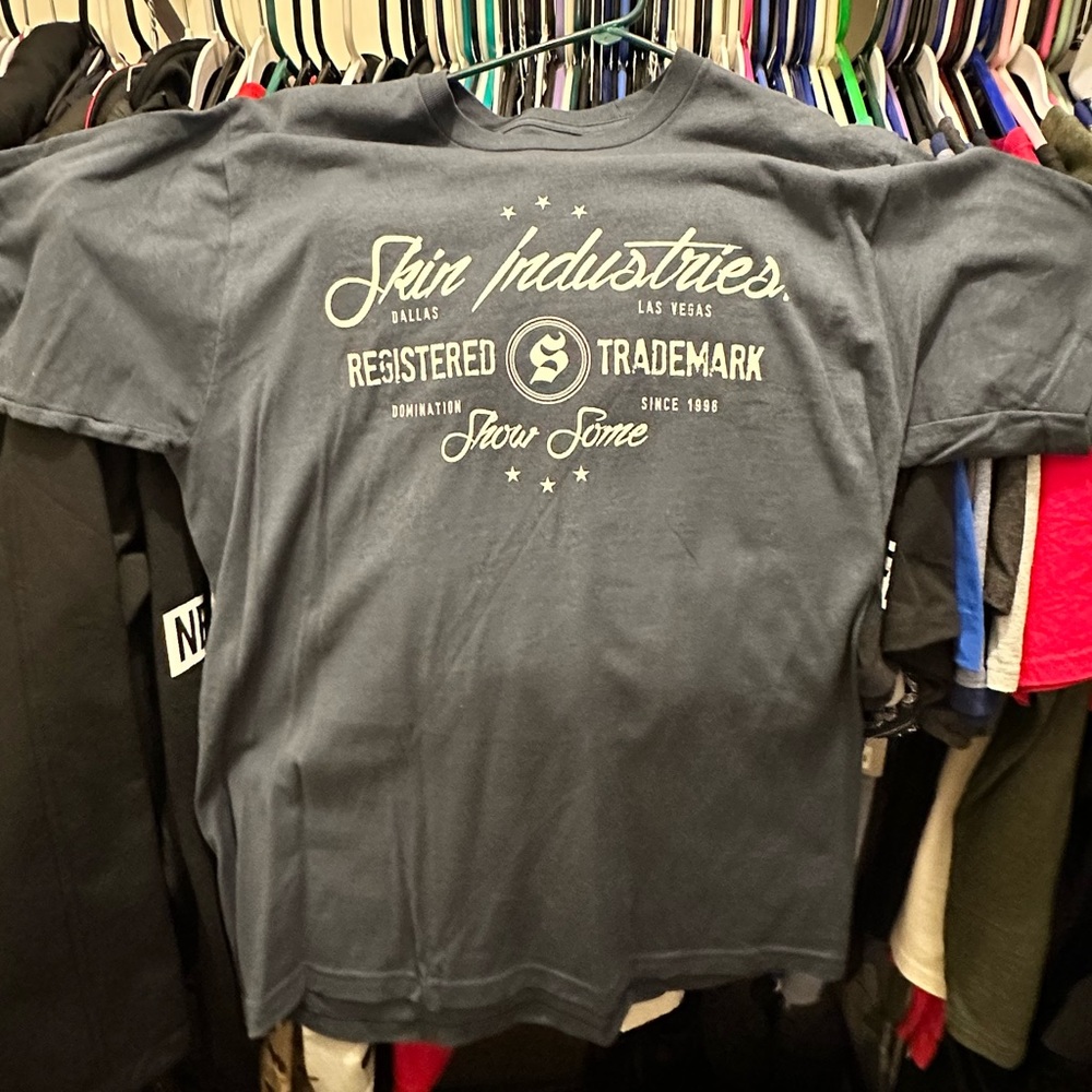 Large blue Skin Industries shirt